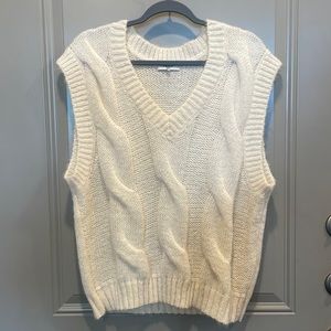 Cream colored layering sweater vest.